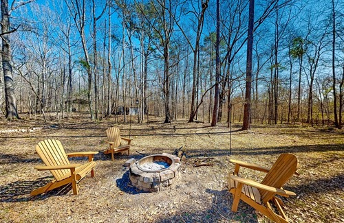 Forsyth Maison | Creekside home with firepit, yard games, deck, wood stove, & W/D