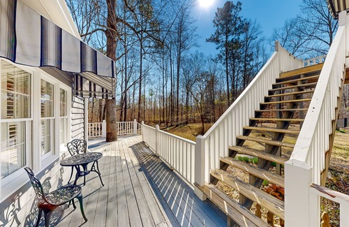 Forsyth Maison | Creekside home with firepit, yard games, deck, wood stove, & W/D