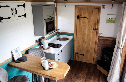 Newcastle-on-Clun Cabine | Cwm Cariad - Shepherds Hut with Hot Tub Sleeping 2 guests, Pet Friendly