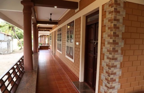 Alappuzha Lit Et Petit-Déjeuner | Dazzle Dew Memories - Deluxe Family Double Room