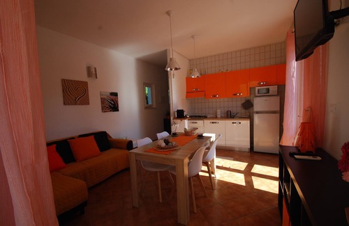 Lacona Appartement | délicieux, 5 places, grands espaces extérieurs avec beaucoup de verdure et d'intimité, zone pour enfants