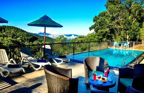 Kandy Villa | Deluxe Family room with balcony and mountain view.