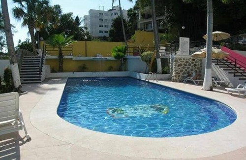 Caleta Appartement | Departamento con vista al mar, albercas y juegos