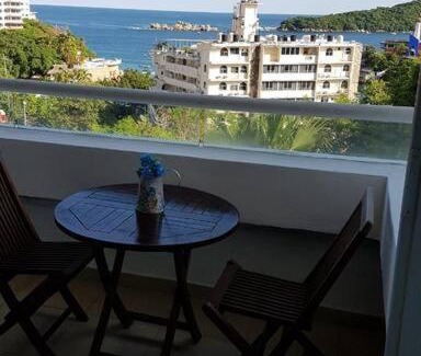Caleta Appartement | Departamento con vista al mar, albercas y juegos