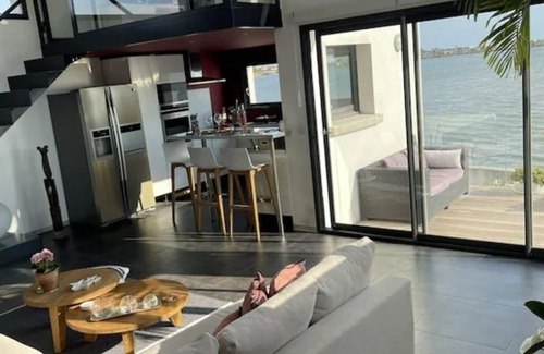 Perols Maison | Villa design avec vue panoramique sur étang, jacuzzi et climatisation