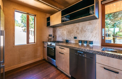 Waiheke Island Maison | Designer living with stunning views across the bay, a spa and coast walks.