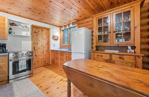 Lion's Head Cabine | Disconnect from it all at Stonewood, a cozy log chalet nestled in cedar forest on Georgian Bay. Enjoy a private shoreline, wraparound deck, wood stove, and access to kayaks, and trails. Peace, comfort, and adventure await in Cape Chin South.