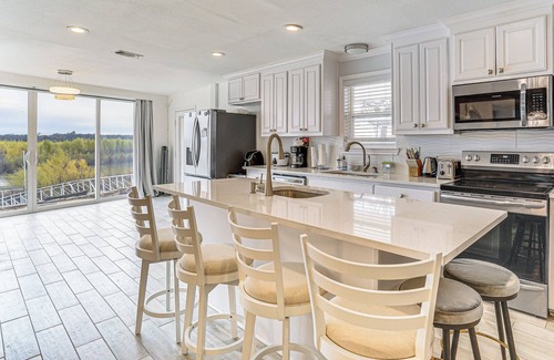 Runaway Bay Maison | Dock & Fire Pit: Riverfront Runaway Bay Retreat