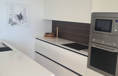 New Golden Mile Appartement | Dominion Beach rez de chaussée app. avec jardin 6 personnes directement au bord de la mer et de la piscine