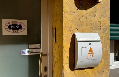 Sant'Antioco Maison | Domo La Vela - Affittacamere - Living Sant'Antioco