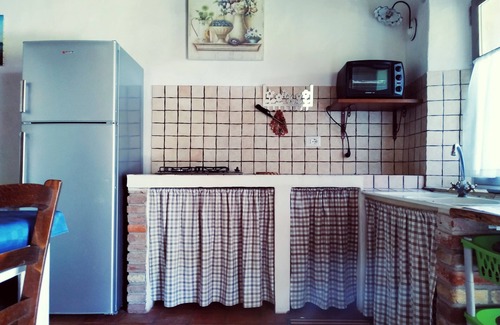 San Giovanni Suergiu Maison | Domusantiga Apartments 2 DOUBLE BEDROOMS, GREEN MEADOW, by the sea