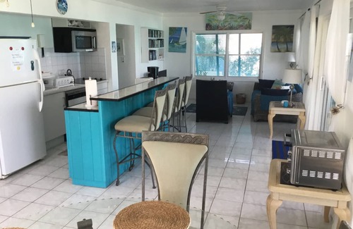 Great Exuma Copropriété | Condo au deuxième étage en bois flotté à Hoopers Bay avec une vue imprenable