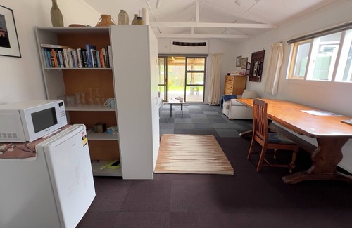 Opunake Cottage | Eco retreat, easy stroll to beach. Organic garden setting