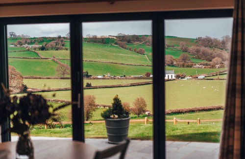 Montgomery Maison | Eithriadol Maldwyn is a collection of luxury countryside homes with a sauna and hot tubs. Pet friendly with electric car chargers, sleeping 16.