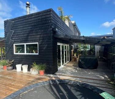 Bowentown Maison | Electric Waihi Beach House - family & dog friendly, close to beach, pool table, outdoor fire room, skate ramp