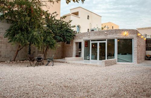 Umm Salal Villa | Elegant Garden Stay with 2 Living Areas, 2 Bedrooms, 1 Full and 1 Half Bath for 6 Guests