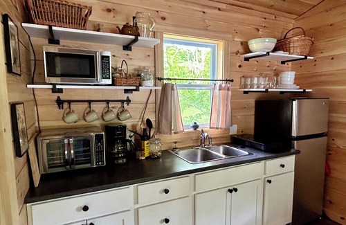 Canterbury Cabine | Elevated cabin nestled among the trees, and the Saint John River. Pet friendly.