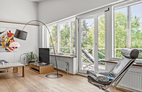 Daugard Maison | Enjoy a relaxing holiday in this holiday home with sea views near Vejle Fjord.