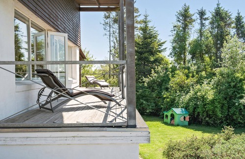 Daugard Maison | Enjoy a relaxing holiday in this holiday home with sea views near Vejle Fjord.