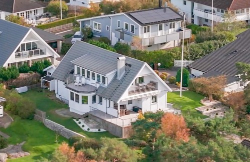 Vastra Frolunda Maison | Enjoy a wonderful view of the archipelago in this comfortable vacation home with sauna.