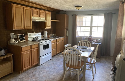 Gordo Cabine | Enjoy our stocked lake and 28 miles to The University of Alabama for football!