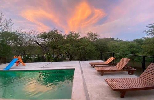Santa Cruz Maison | Enjoy privacy and nature in this open concept home and relaxing pool.