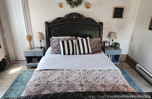 Lansing Maison | Enjoy the top floor of this victorian house With two suites & a bonus bedroom