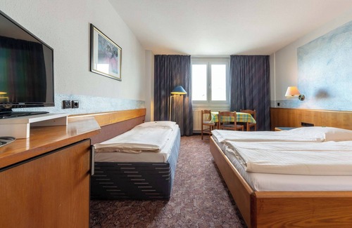 Korntal-Munchigan Lit Et Petit-Déjeuner | enjoyHotel garni Korntal Stuttgart
