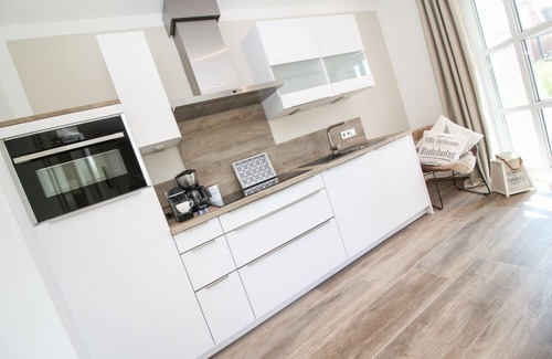 Greetsiel Appartement | Entspannung Pur: Moderne Ferienwohnung 'viel Meer' mit Sauna und Garten