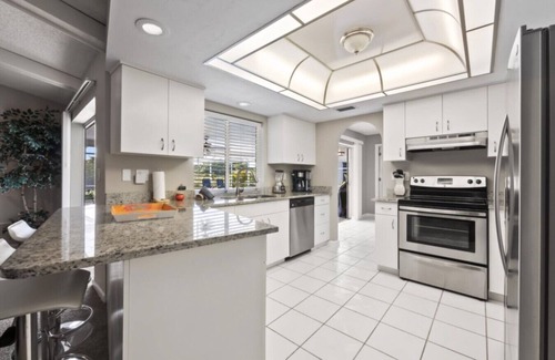 Caloosahatchee Maison | Escape to this charming 3-bedroom house in Cape Coral
