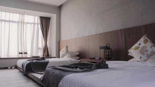 Longmen County Hôtel | Even's Garden