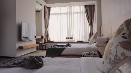 Longmen County Hôtel | Even's Garden