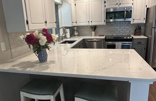 Wolfeboro Maison | Family Friendly house with lakefront views surrounded by trees