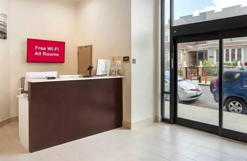 Queens Maison | Family Ready Rooms with Two Queens | Quick Train Ride to New York City