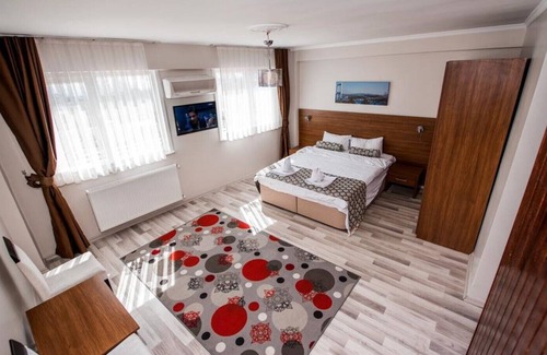Emin Sinan Appartement | Chambre familiale avec vue sur la mer