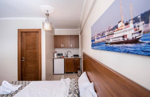 Emin Sinan Appartement | Chambre familiale avec vue sur la mer