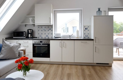 Toenning Appartement | FeWo Solskin - Sur les toits de Tönnings