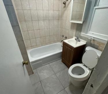 Irvington Maison | Fidelia Emerald Room Queen Bed within minutes of Newark Liberty International Airport and Newark Penn Station