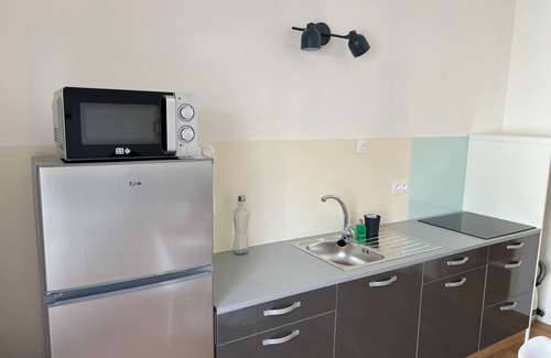 Brezins Appartement | Appartement en rez-de jardin