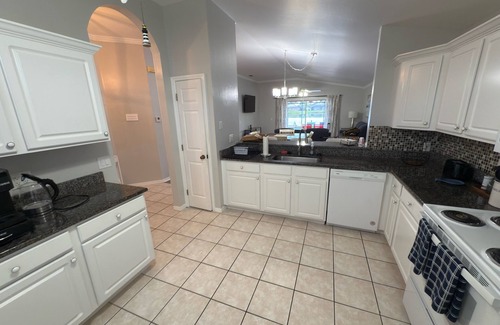 Beachwalk Isles Maison | Gorgeous lake view sunsets with heated, enclosed pool. Close to beaches and golf