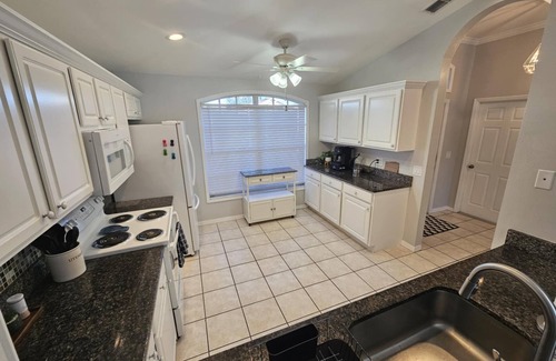 Beachwalk Isles Maison | Gorgeous lake view sunsets with heated, enclosed pool. Close to beaches and golf