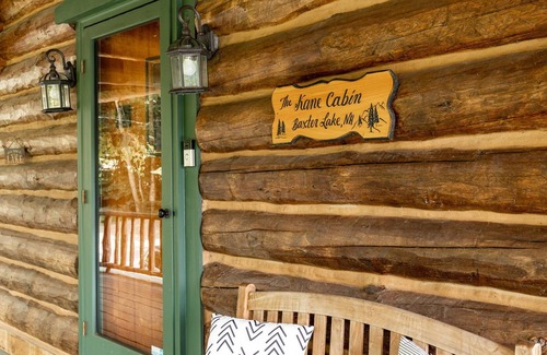 Farmington Maison | GORGEOUS log home with hot tub and private beach on peaceful Baxter Lake in NH