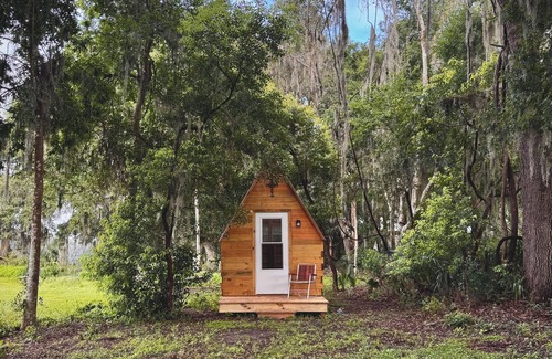 Reddick Cabine | Grass Campers whimsical 1 room Glamping Forest Hideaway Sugar Shanty near WEC
