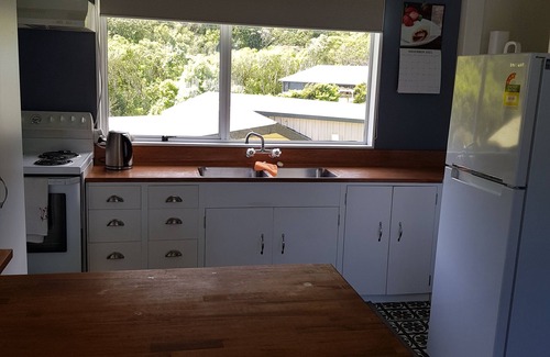 Okiwi Bay Maison | Great views from this double storey bach. Very close to sandy beach.