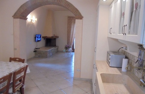 Chianni Maison | Appartement rez de chaussée avec loggia et jardin, vue panoramique