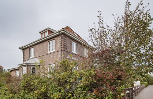 Langeoog Appartement | Helle Ferienwohnung auf Langeoog mit Gartennutzung für bis zu Vier Personen