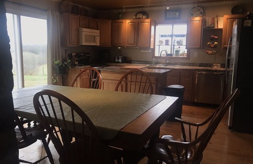 Carlisle Maison | Hilltop Farmhouse with sunrise/sunset porches overlooking hills and farm field