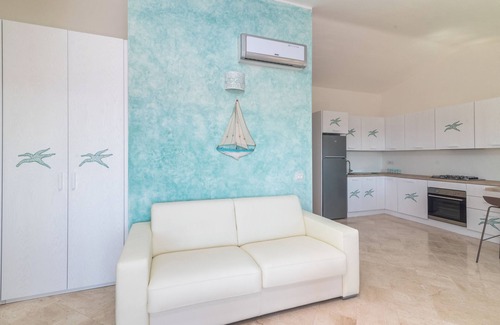 Santa Teresa di Gallura Appartement | Appartement de vacances "Stella Maris" avec vue sur la mer, piscine partagée et terrasse privée