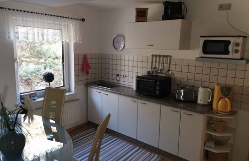 Lietzow Appartement | Appartement de vacances avec vue sur le petit Bodden de Jasmund et meubles de jardin