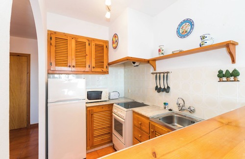 Arenal d'en Castell Appartement | Appartement de vacances "Apartamento en Arenal Castell" avec Wi-Fi, A/C, Piscine, Terrasse et Jardin